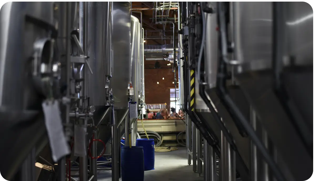 Stainless fermentation tanks in microbrewery interior