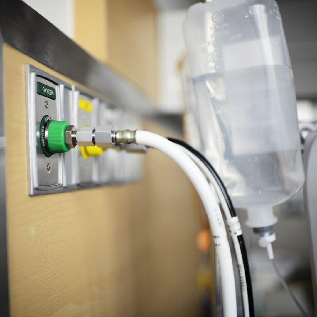 Hospital oxygen outlet and IV fluid bag